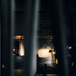 Illuminated lights seen through window at night