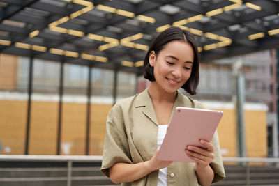 Young woman using mobile phone