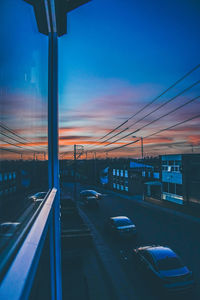 Traffic on road at sunset