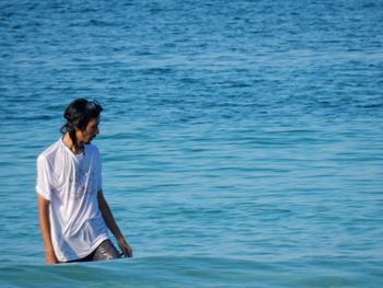 Man walking in sea