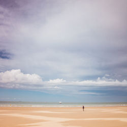 Man on beach against sky