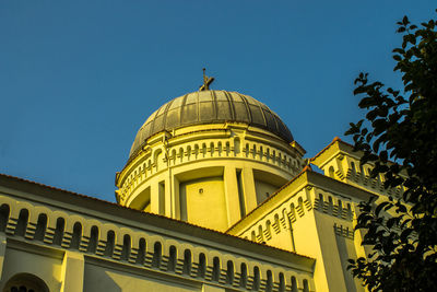 Low angle view of building against clear blue sky