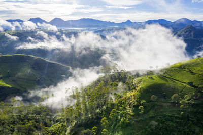 Scenic view of waterfall against sky