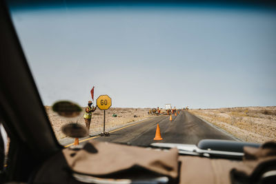 Road seen through car windshield