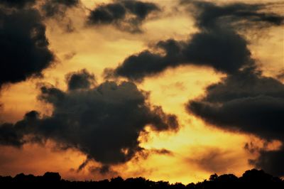Low angle view of dramatic sky during sunset