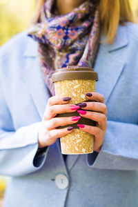 Close-up of woman holding drink