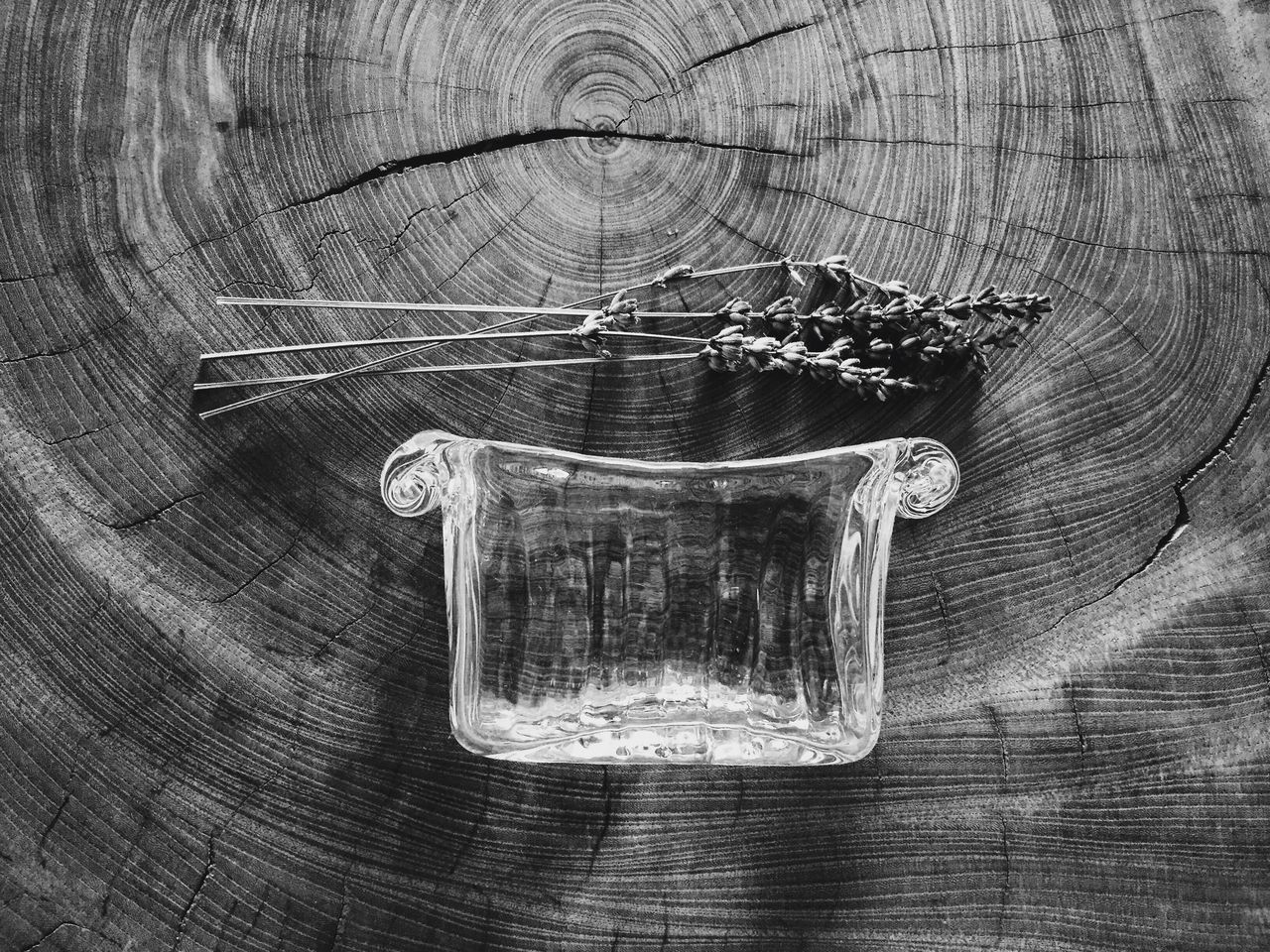 indoors, table, wood - material, close-up, still life, glass - material, empty, transparent, no people, wooden, high angle view, drinking glass, day, absence, water, focus on foreground, wall - building feature, glass, reflection, fragility