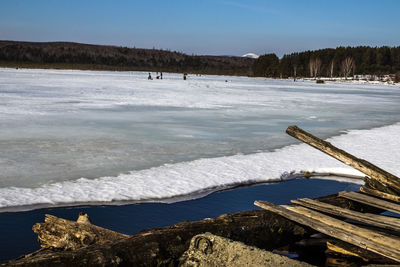 Scenic view of frozen lake against sky