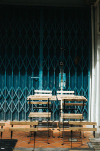 Empty chairs and tables in restaurant