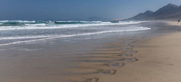 Scenic view of beach against sky