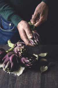 Close-up of person preparing food on table