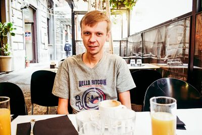 Portrait of a smiling mid adult man in restaurant