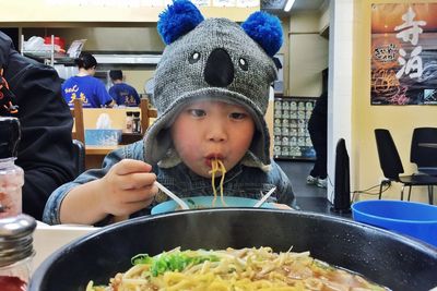 Full length of girl eating food