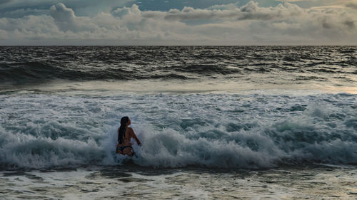 Full length of man on beach against sky