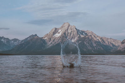 Scenic view of lake against mountain range