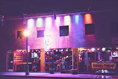 Illuminated street market at night