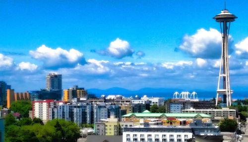 Silhouette of buildings against cloudy sky