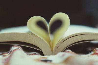 Close-up of heart shape on book