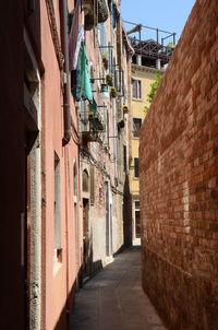 Narrow alley amidst buildings in city