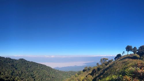 Scenic view of mountains against clear blue sky