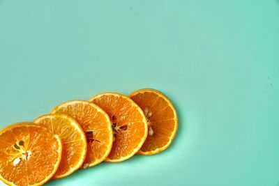 Close-up of orange slice against white background