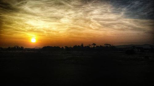 Scenic view of landscape against sky during sunset