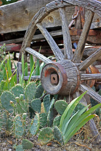 Close-up of abandoned wheel on field