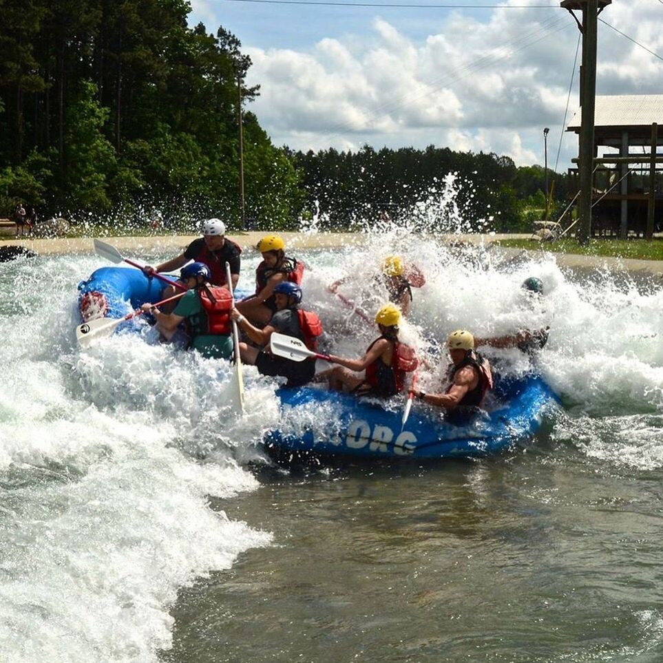 PEOPLE ENJOYING IN BOAT ON RIVER AGAINST SKY