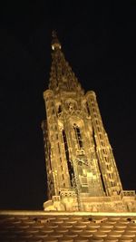 Low angle view of illuminated building at night