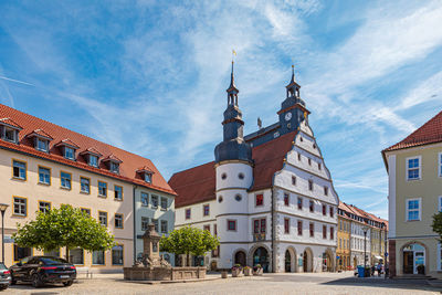 Buildings in city against sky