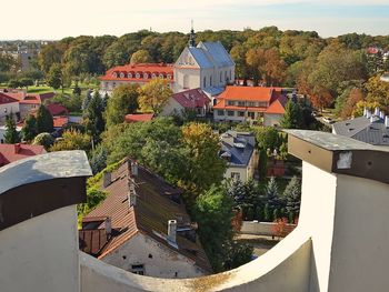 High angle view of trees and buildings against sky