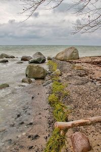 Scenic view of sea against cloudy sky