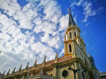 Low angle view of cathedral against cloudy sky