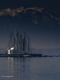 Sailboats in sea against sky