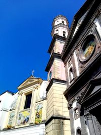 Low angle view of church against blue sky