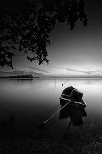 Boat on lake against sky