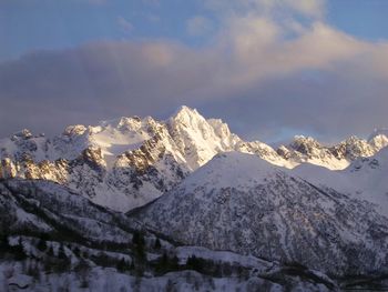 Scenic view of snowcapped mountains against sky