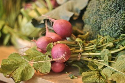 Close-up of radish and broccoli on table