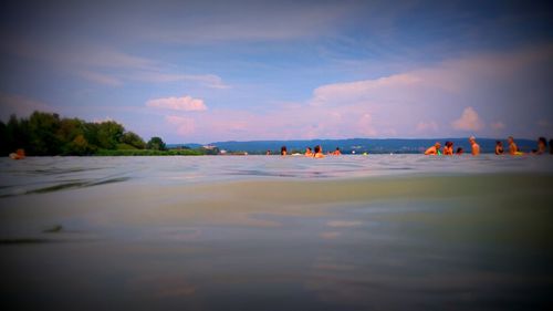 Scenic view of beach against sky during sunset