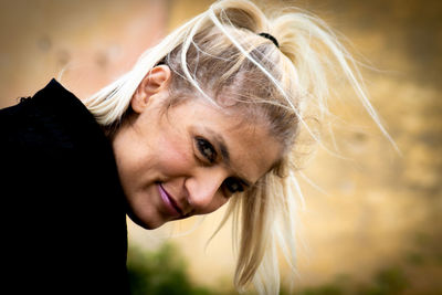 Close-up of young woman looking away