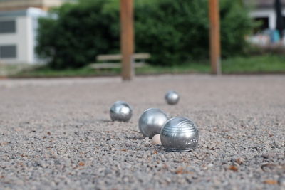 Metallic balls on land