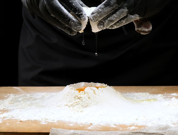Midsection of person preparing food
