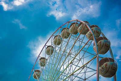 Low angle view of ferris wheel against sky