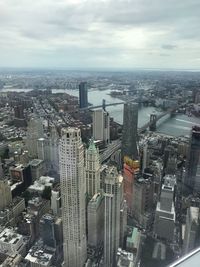 High angle view of modern buildings in city against sky