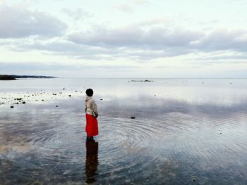 Side view of woman in calm sea
