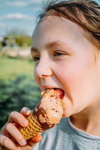 Close-up of woman eating ice cream