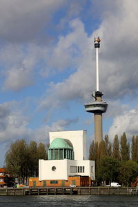 Low angle view of building against cloudy sky