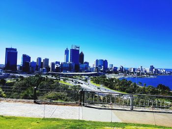 Cityscape against clear blue sky