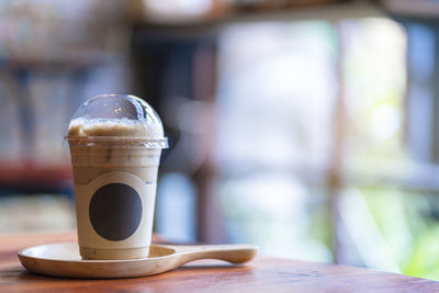 Close-up of coffee cup on table