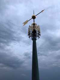 Low angle view of communications tower against sky